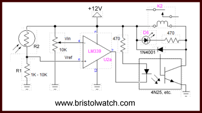 LM339 comparator uses CdS photocell to control night light.